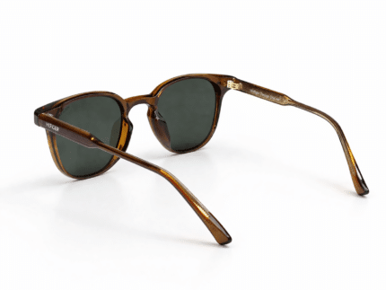 Unisex transparent brown frame sunglasses with round shape and dark tinted lenses, perfect for travel, driving, and outdoor use